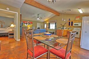 a kitchen and living room with a table and chairs at Three Horses Ranch in Johnson City