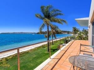 a balcony with a view of the ocean at Wanda Beach Unit 2 Soldiers Point Road in Salamander Bay