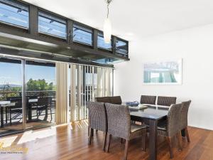 a dining room with a table and chairs at One Mile Ridge No 15 in Boat Harbour