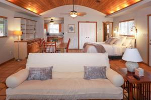 a living room with two beds and a couch at Burnett Ranch Cabins- Rosemary in Wimberley