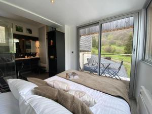 Postel nebo postele na pokoji v ubytování Aux 500 Diables Eco Lodge - Hotel