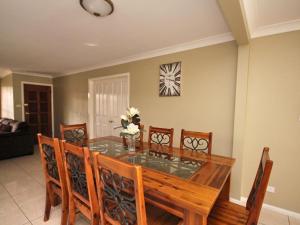 a dining room with a glass table and chairs at North Heaven Station in North Haven +14 photos