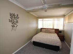 a bedroom with a bed and a window at North Heaven Station in North Haven