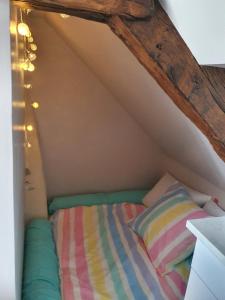 Postel nebo postele na pokoji v ubytování Le Fiege gîte cosy et confort