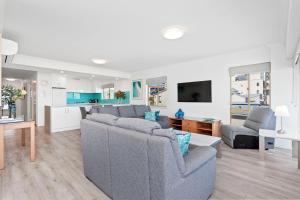 a living room with two couches and a kitchen at Suite 310 Sandcastles 3 Bedroom Deluxe in Perth