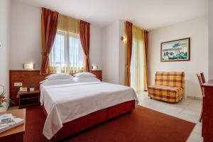 Postel nebo postele na pokoji v ubytování Hotel Posejdon