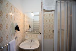 a bathroom with a sink and a shower at Villa Moschella in Taormina +107 photos