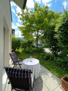 a table and chairs sitting on a patio at Ferienwohnung Lennefer in Piding