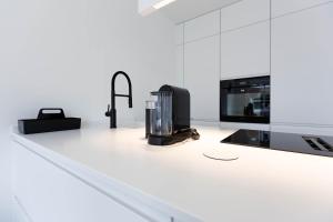 a kitchen with a counter with a microwave and a appliance at Pur A4 in Wustrow