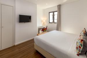 Hotel Cidade de Olhão客房内的一张或多张床位
