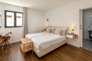 Hotel Cidade de Olhão客房内的一张或多张床位