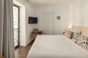 Hotel Cidade de Olhão客房内的一张或多张床位
