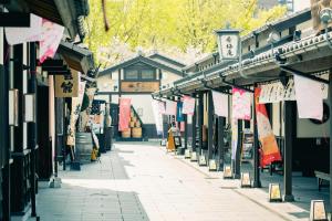 a street in an asian city with signs on buildings at Kumamoto - Apartment / Vacation STAY 81139 in Kumamoto