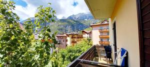 a balcony with a view of a city and mountains at Hotel Paganella in Molveno