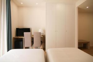 Postel nebo postele na pokoji v ubytování Hotel Bulevard