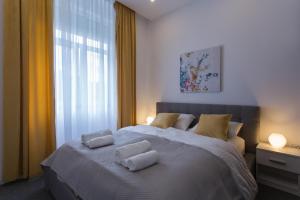 Ein Bett oder Betten in einem Zimmer der Unterkunft Elenas Rooms & Apartment