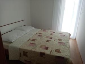 Postel nebo postele na pokoji v ubytování Pave Apartment