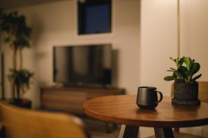 TV a/nebo společenská místnost v ubytování THREE