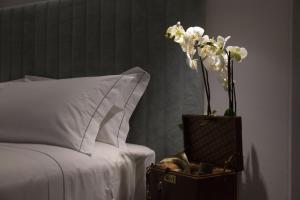 Voodi või voodid majutusasutuse Grand Hotel San Gemini I UNA Esperienze toas
