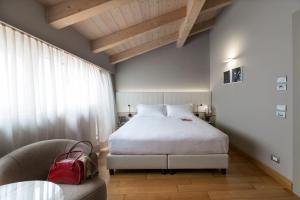 Voodi või voodid majutusasutuse Grand Hotel San Gemini I UNA Esperienze toas