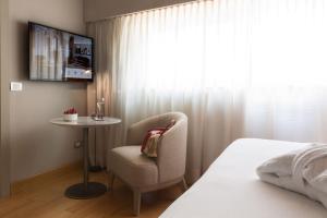 Voodi või voodid majutusasutuse Grand Hotel San Gemini I UNA Esperienze toas