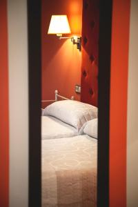 A bed or beds in a room at Posada Cicero