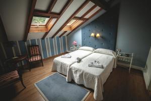 A bed or beds in a room at Posada Cicero