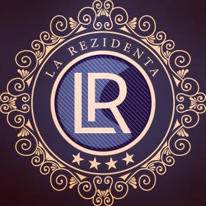 a gold and blue emblem with a registered trademark at La Rezidenta in Sibiu