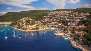 an aerial view of a town with boats in the water at Studio Apartman Viktoria Rabac in Rabac