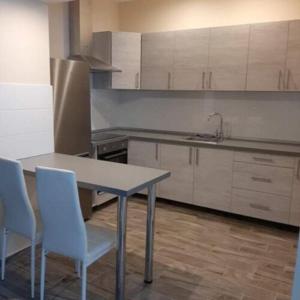 A kitchen or kitchenette at Vándor Vendégház