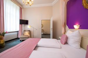Postel nebo postele na pokoji v ubytování W22 Hotel am Kurfürstendamm