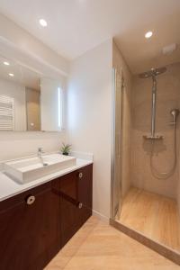 a bathroom with a sink and a shower at Opera in Paris