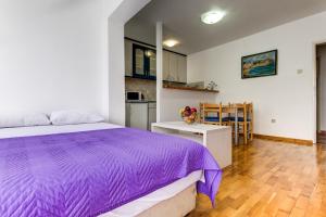 Ένα ή περισσότερα κρεβάτια σε δωμάτιο στο Sun Apartments Marija