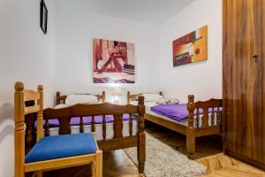 Ένα ή περισσότερα κρεβάτια σε δωμάτιο στο Sun Apartments Marija
