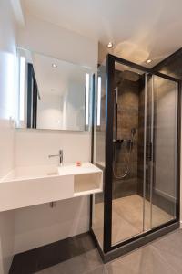 a bathroom with a sink and a shower at Atelier in Paris +25 photos