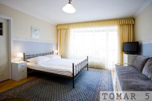 Postel nebo postele na pokoji v ubytování TOMAR