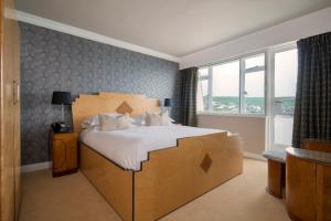 a large bed in a cardboard box in a room at Burgh Island Hotel in Bigbury on Sea