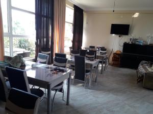 TV a/nebo společenská místnost v ubytování Guesthouse Achi