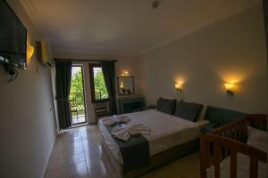 TV a/nebo společenská místnost v ubytování Kilim Hotel & Apart