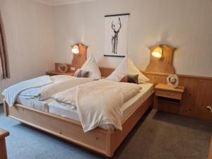 A bed or beds in a room at Landhotel Hof Barrl