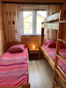 A bunk bed or bunk beds in a room at Pod Sokołem