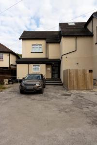 a car parked in front of a house at 2A SPV Double En-suite Room in Wakefield