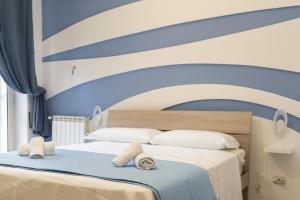 A bed or beds in a room at Terrazza Garibaldi