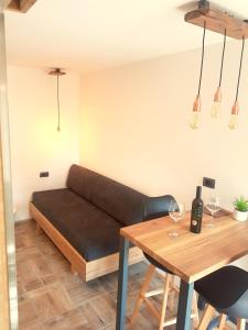 a living room with a couch and a table at Wine cellar room in Vipava