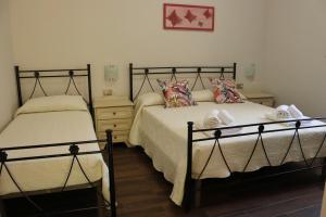 A bed or beds in a room at Villa Rosada