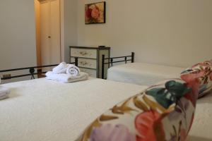 A bed or beds in a room at Villa Rosada