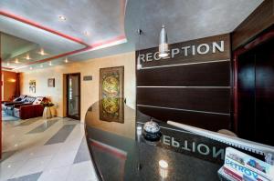 a reception area of a hotel with a reception desk at Petrov Family Hotel in Nesebar