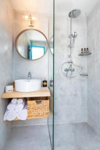a bathroom with a sink and a mirror at Nacros Villa Olympos Karpathou in Olympos