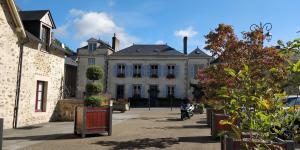 a person sitting on aooter in front of a building at Sweeting's B & B Chailland in Chailland +31 photos