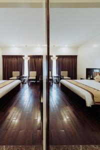 White Palace Thai Binh Hotel客房内的一张或多张床位